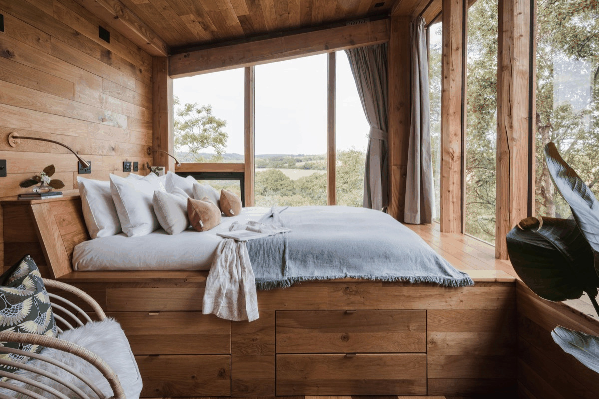 Bedroom with a private hot tub view
